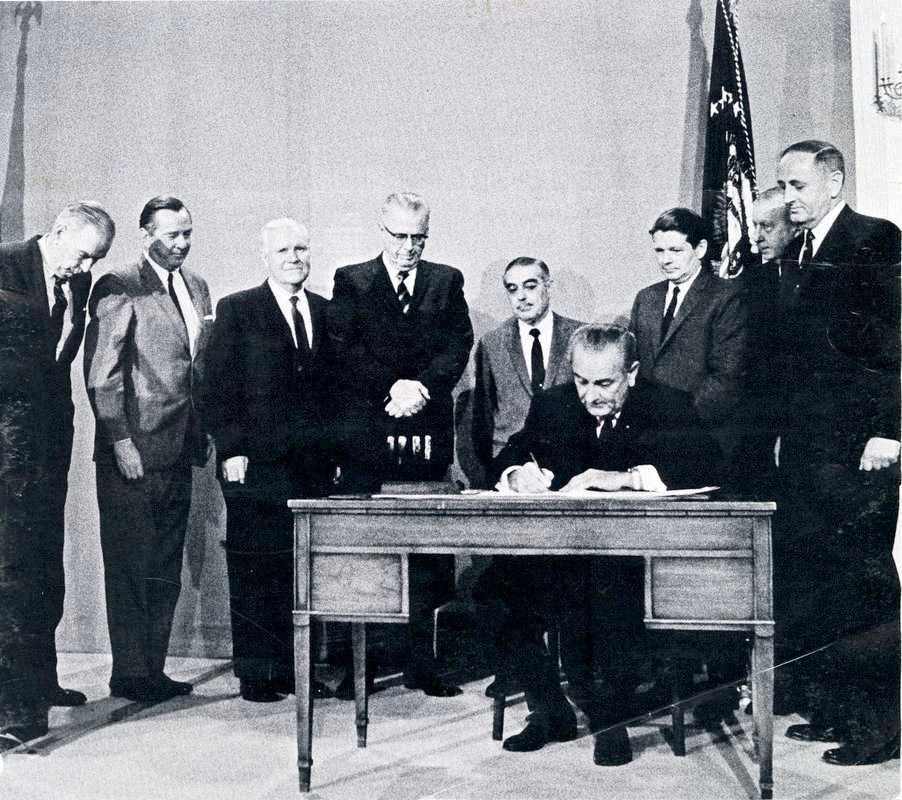 President Lyndon Johnson signs the Public Broadcasting Act on November 7, 1967. Yoichi Okamoto, LBJ Library.